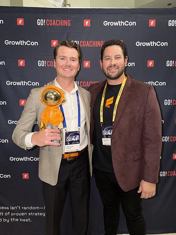 Trevor Sanders receiving GoGetter Award at GrowthCon Chicago